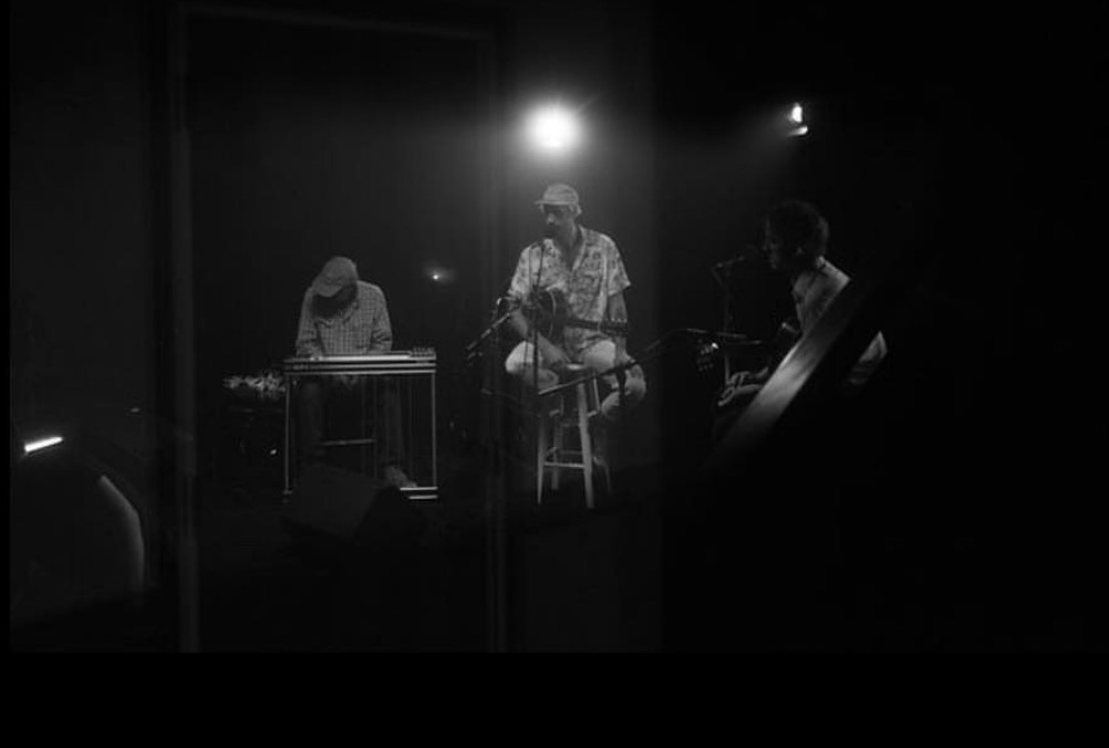 Musicians performing together in an intimate setting